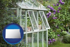 north-dakota map icon and a garden greenhouse